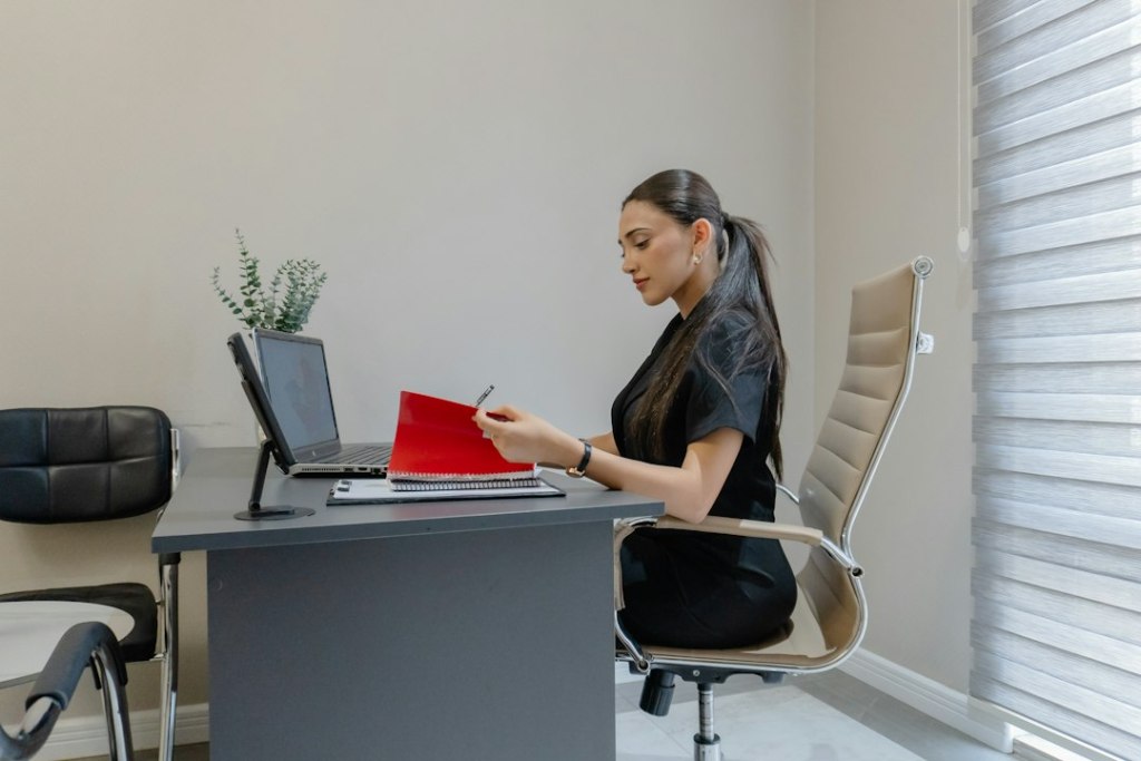 Property manager reviewing rental application documents for a Riverside rental property